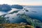 From top of the famous Reinebringen overlooking the city of Reine in Lofoten,Norway during the midnight sun.