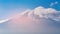 Top of Fuji mountain volcano and cloudy moving covered