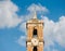 The top is a high chapel and a bell tower roof with a blue sky