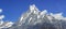 Top of the hill, covered with snow and white clouds