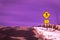 At the top of the hill, a pedestrian crossing sign and weird purple sky - what is on the other side?