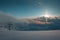 Top of the krvavec ski slope, bathing in the last rays of sun setting behind clouds
