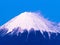The top of Mount Fuji covered in snow