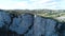 Top of a mountain with a beautiful view in the background on a sunny day. Shot. Top view of a mountain cliff on a Sunny