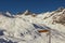 In the top of the mountain with sign in Italy - winter season - adventure snow - Aosta - Champorcher