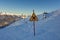 In the top of the mountain with sign in Italy - winter season - adventure snow - Aosta - Champorcher