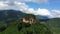 The top of a mountain surrounded by lush green rainforest