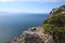 Top of a mountain with view across a bay