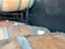 Top of multiple barrel aged wine barrel stopper cork plug in a winery