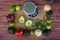 Top overhead view of fresh guacamole ingredients with a weight scale