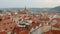 Top panorama of red roofs of old town of Prague, restaurant on a roof