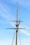Top part of the Pride Memorial mast against blue winter sky. T