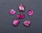 Top quality A grade small rough RUBY crystals from Tanzania on black. RED CORUNDUM.