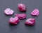 Top quality A grade small rough RUBY crystals from Tanzania on black. RED CORUNDUM.