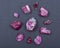 Top quality A grade small rough RUBY crystals from Tanzania on black. RED CORUNDUM.