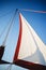 Top of the sailboat, mast head, sail and nautical rope yacht detail. Yachting, marine background