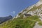 The top the Santis mountain with its weather station in the Alpstein range Appenzell, Switzerland as seen from a trail leading up