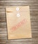 Top Secret package on wood background