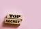 Top secret phrase made wooden blocks. Successful Trading business concept
