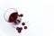 Top shot, close up of fresh sweet cherry with water drops, cherry juice in glass on white background, selective focus,