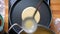 Top shot, delicious yellow pancake is prepared on frying pan, organic breakfast