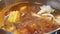 Top shot of hot pot boiling inside Chinese restaurant