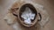 Top shot of linen laundry basket with guest towels on a floor