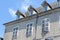 Top of simple original townhouse with shuttered windows in French Pyrenees, France