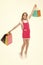 Top tips for smart kid clothes shopping. Girl cute teenager carries shopping bag. Kid bought clothing summer sale