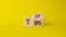 Top Tips symbol. Turned wooden cubes with words Top Tips. Beautiful yellow background. Business and Top Tips concept. Copy space