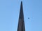 Top of Transamerica Pyramid with fighter jet flying