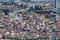 Top urban view of lots houses in Istanbul city, Turkey. Crowded red roofs and mosque.