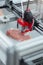 Top view of 3D printer creating piece of meat