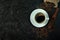 Top view above of Black hot coffee with milk foam for morning beverage menu in white ceramic cup