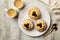 Top view of above, Zeppole di San Giuseppe, zeppola - baked puffs made from choux pastry, filled and decorated with custard cream