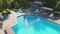 Top of view of aerial flying drone view of swimming pool in resort