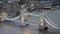 Top view aerial panorama of city lights at sunset dusk and ship navigation on Thames River under the Tower Bridge in London