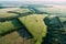 Top view, aerial photo from drone or aerostat to summer nature landscape panorama, green meadows in countryside at sunset time