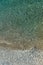 Top view aerial photo of sea waves with turquoise water from unmanned flying