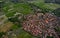 Top view or aerial shot of fresh green and yellow rice fields. Aerial view of Planted Rice fields and rural villages, geometry of