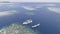 Top view or aerial view of beautiful clear water and white beach with long tail boats on summer tropical island called Karimunjawa