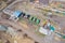 Top view on agricultural machinery near the hangar in the village for planting and harvesting. Tractor, plow, combine fuel truck