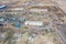 Top view on agricultural machinery near the hangar in the village for planting and harvesting. Tractor, plow, combine fuel truck