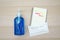 Top view of alcohol sanitizer gel and mask with message Coronavirus and notebook with memo about the pandemic Covid-19 and