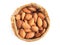 Top view almonds seeds in sackcloth bag isolated on a white background.