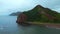 Top view of amazing landscape of mountain coast on cloudy day. Clip. Cinematic landscape of coast with rocky green