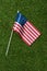 top view of american flagpole on green grass, americas independence