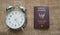 Top- view analog clock and passport table on sack background , v