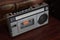 Top view antique gray radio on wooden background,vintage,copy space