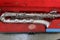 top view of antique silver saxophone instrument collection  broken instrument  can't use